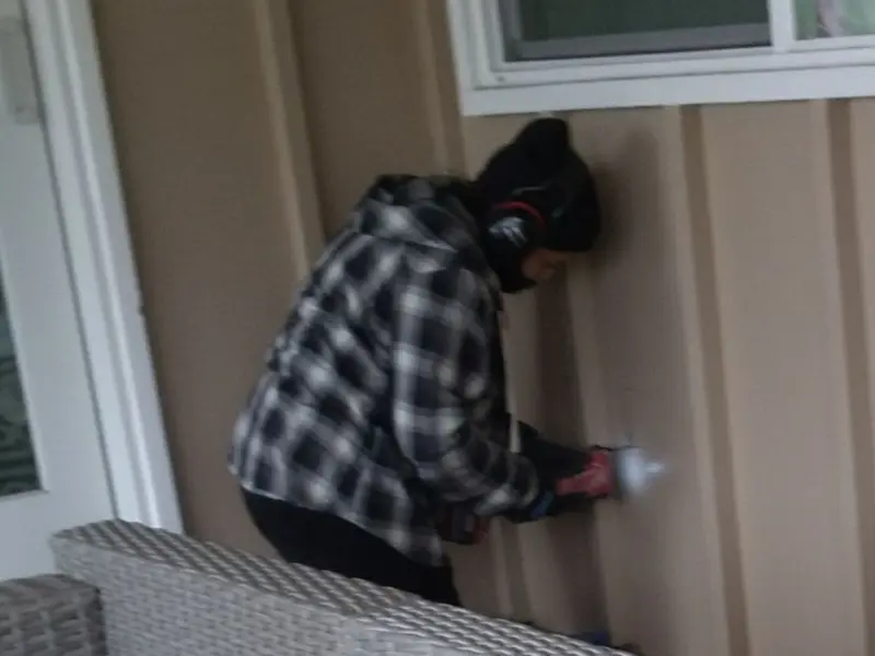 Professional electrician installing an exterior outlet in Mount Lebanon